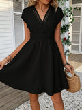 French lace V-neck fitted dress with waistline and short puff sleeves. Striped texture short skirt with vertical lines. Beach-st