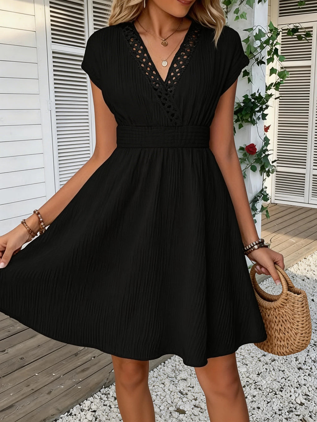French lace V-neck fitted dress with waistline and short puff sleeves. Striped texture short skirt with vertical lines. Beach-st